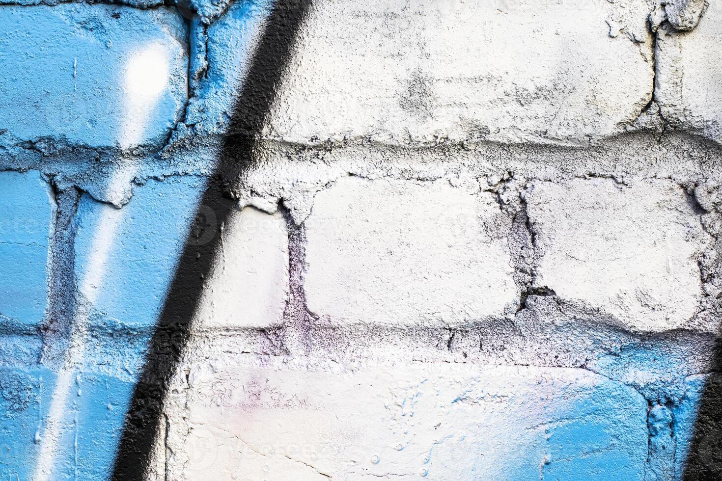 Graffiti painted on a brick wall texture. photo