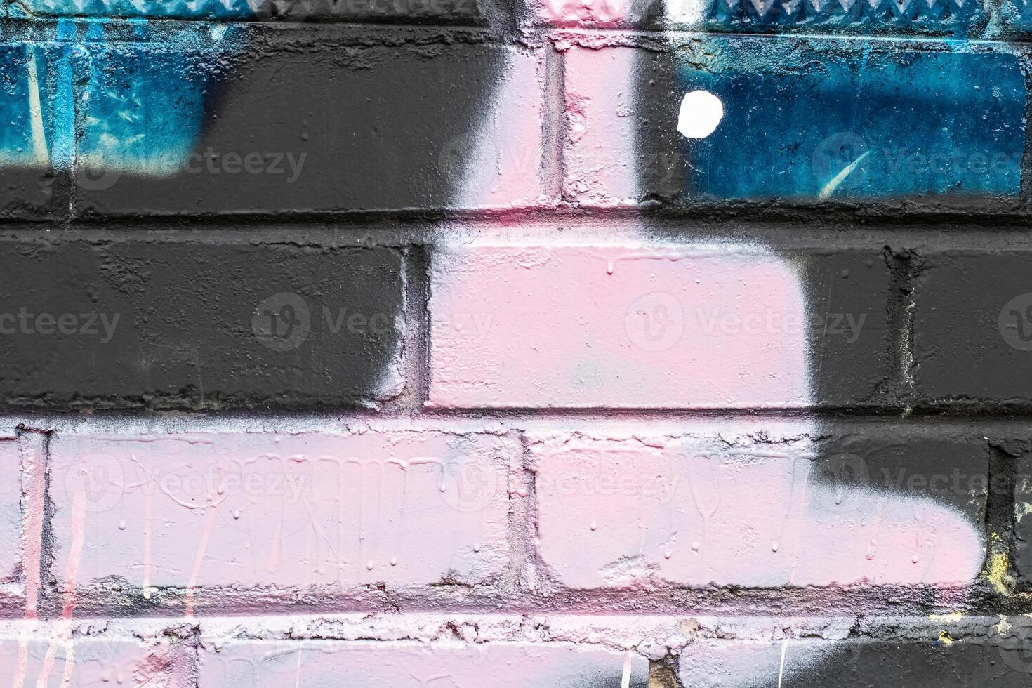 Graffiti painted on a brick wall texture. photo