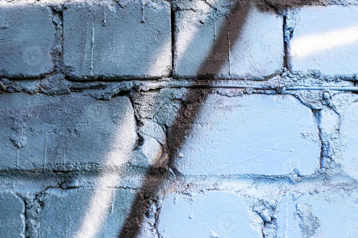 Graffiti painted on a brick wall texture. photo