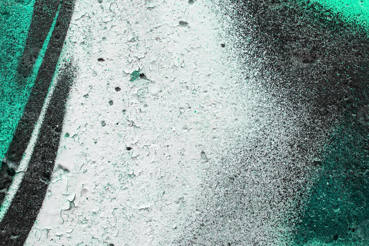 Graffiti painted on a concrete wall texture. photo