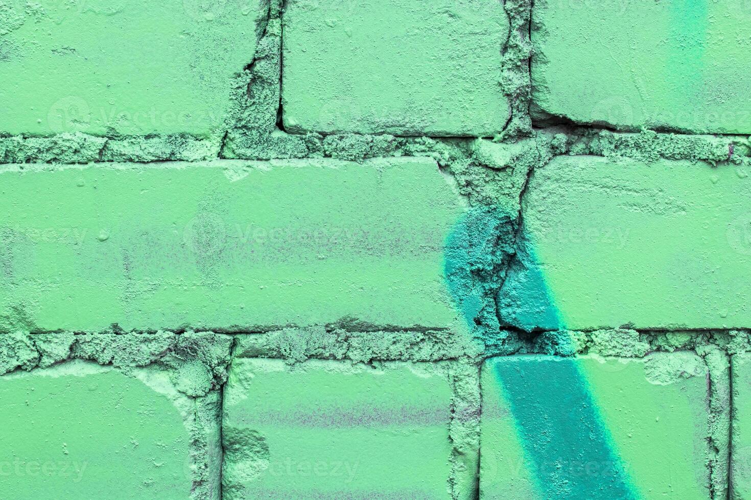 Graffiti painted on a brick wall texture. photo