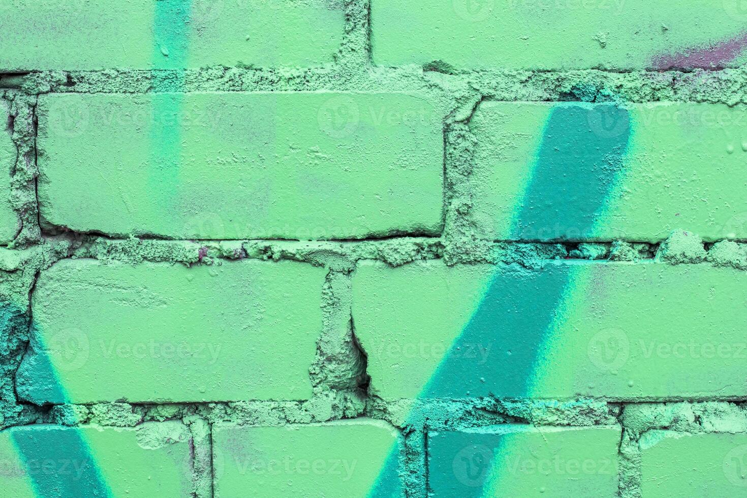 Graffiti painted on a brick wall texture. photo