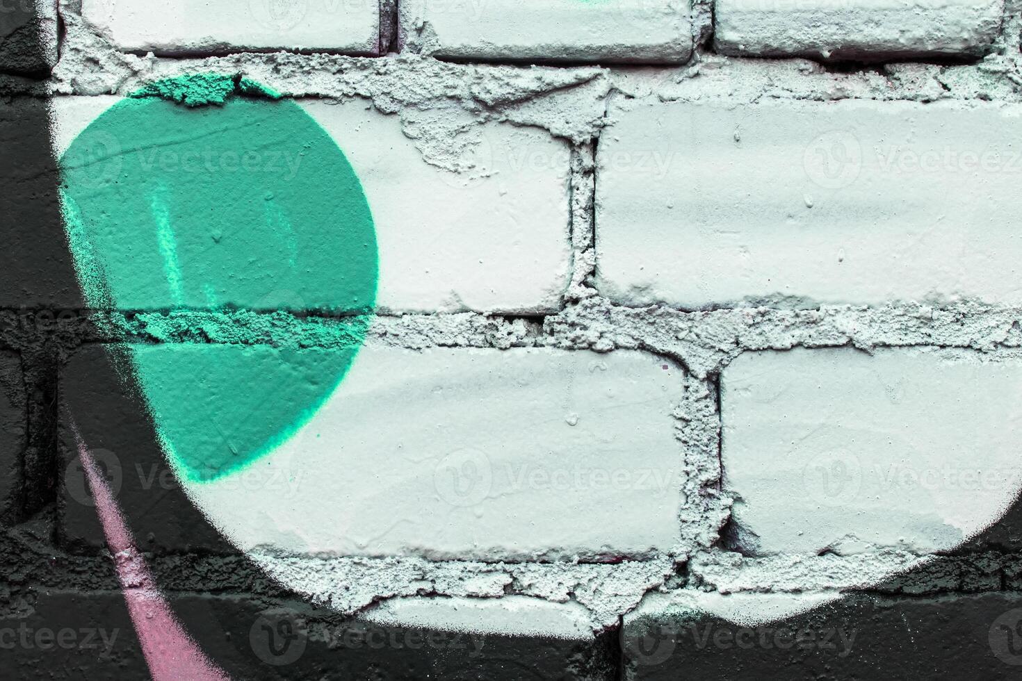 Graffiti painted on a brick wall texture. photo
