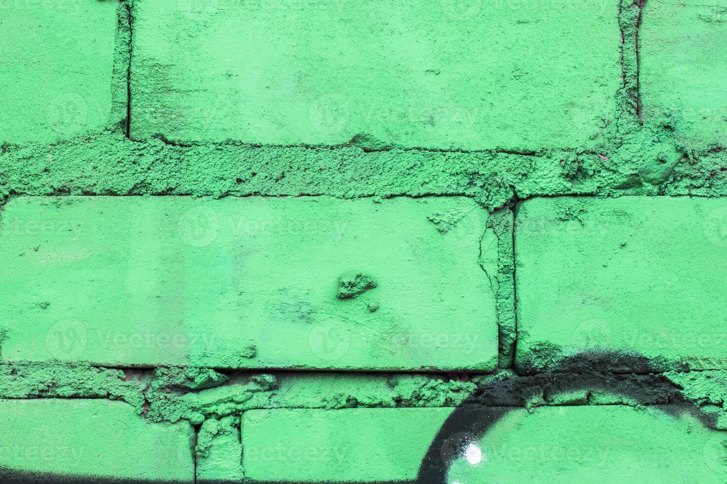 Graffiti painted on a brick wall texture. photo