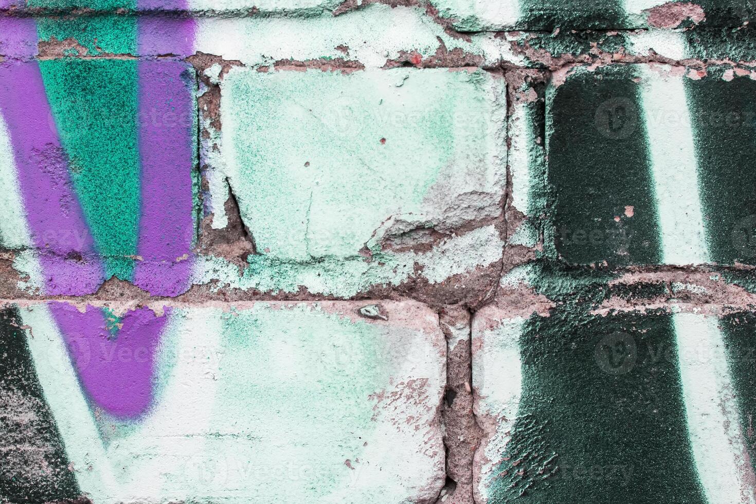 Graffiti painted on a brick wall texture. photo