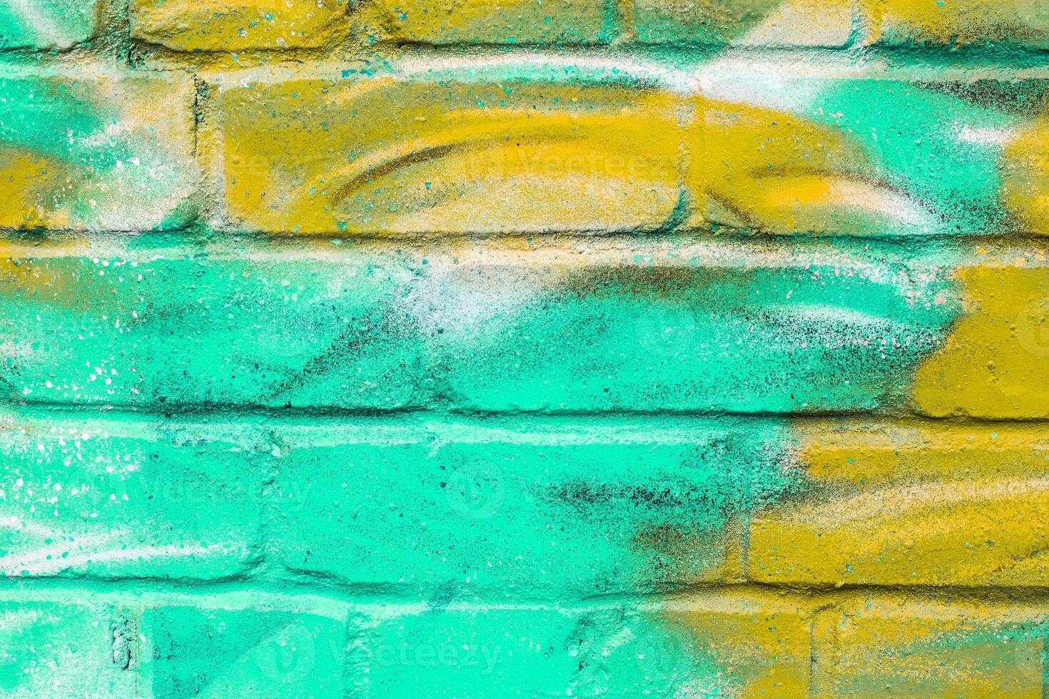 Graffiti painted on a brick wall texture. photo