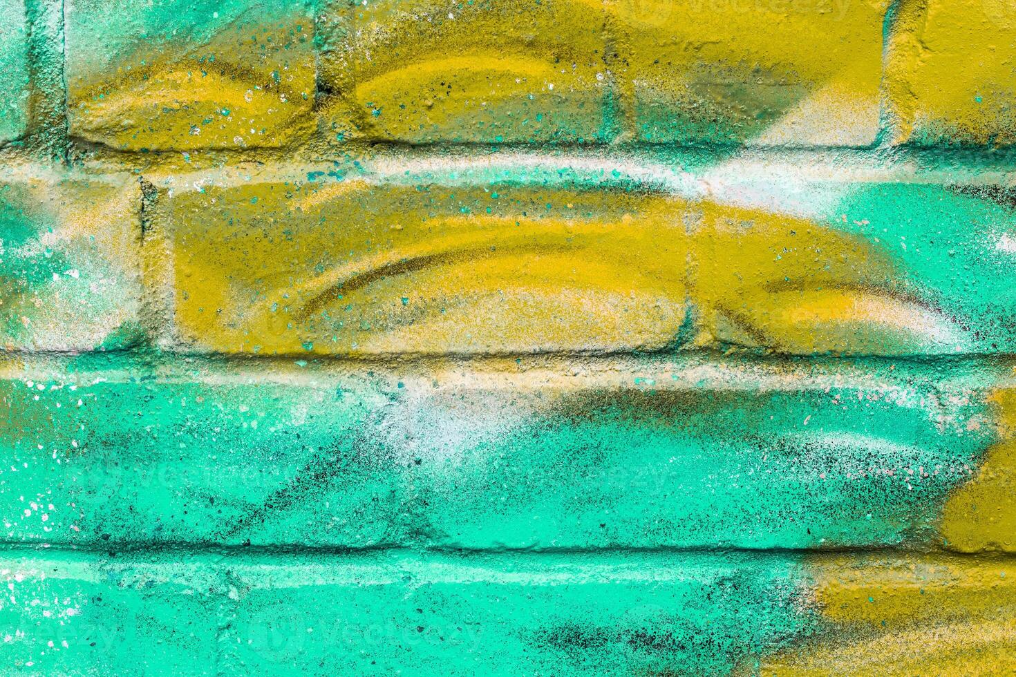 Graffiti painted on a brick wall texture. photo