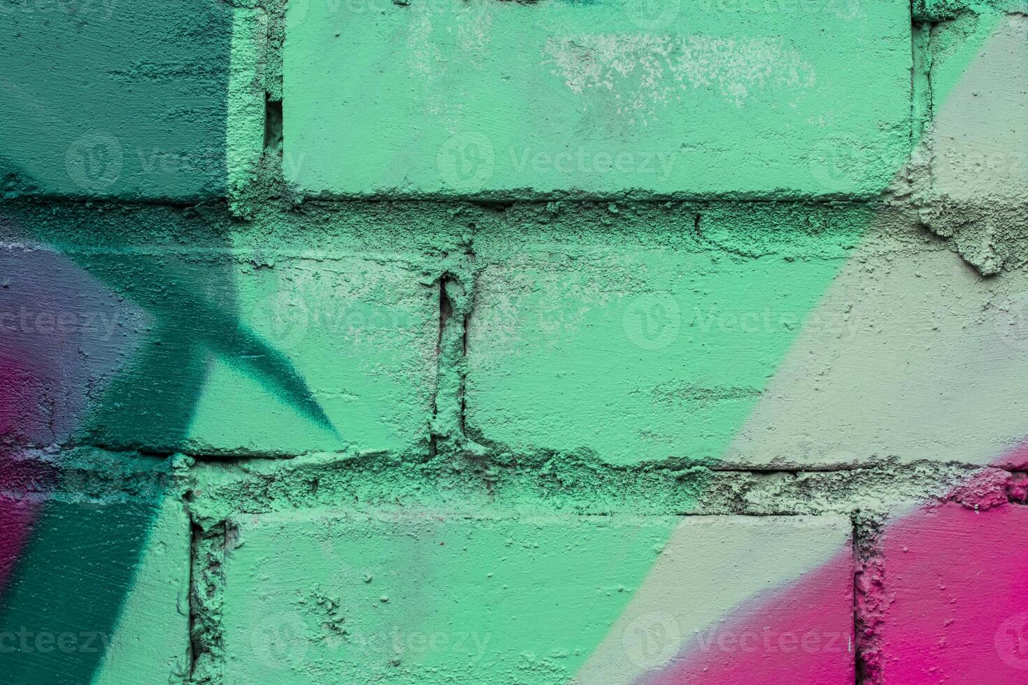Graffiti painted on a brick wall texture. photo