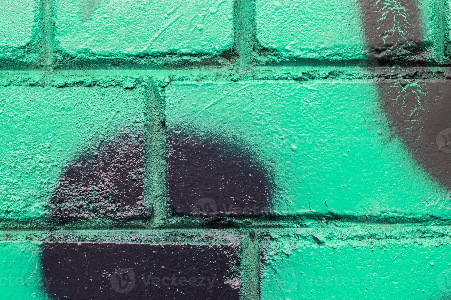 Graffiti painted on a brick wall texture. photo