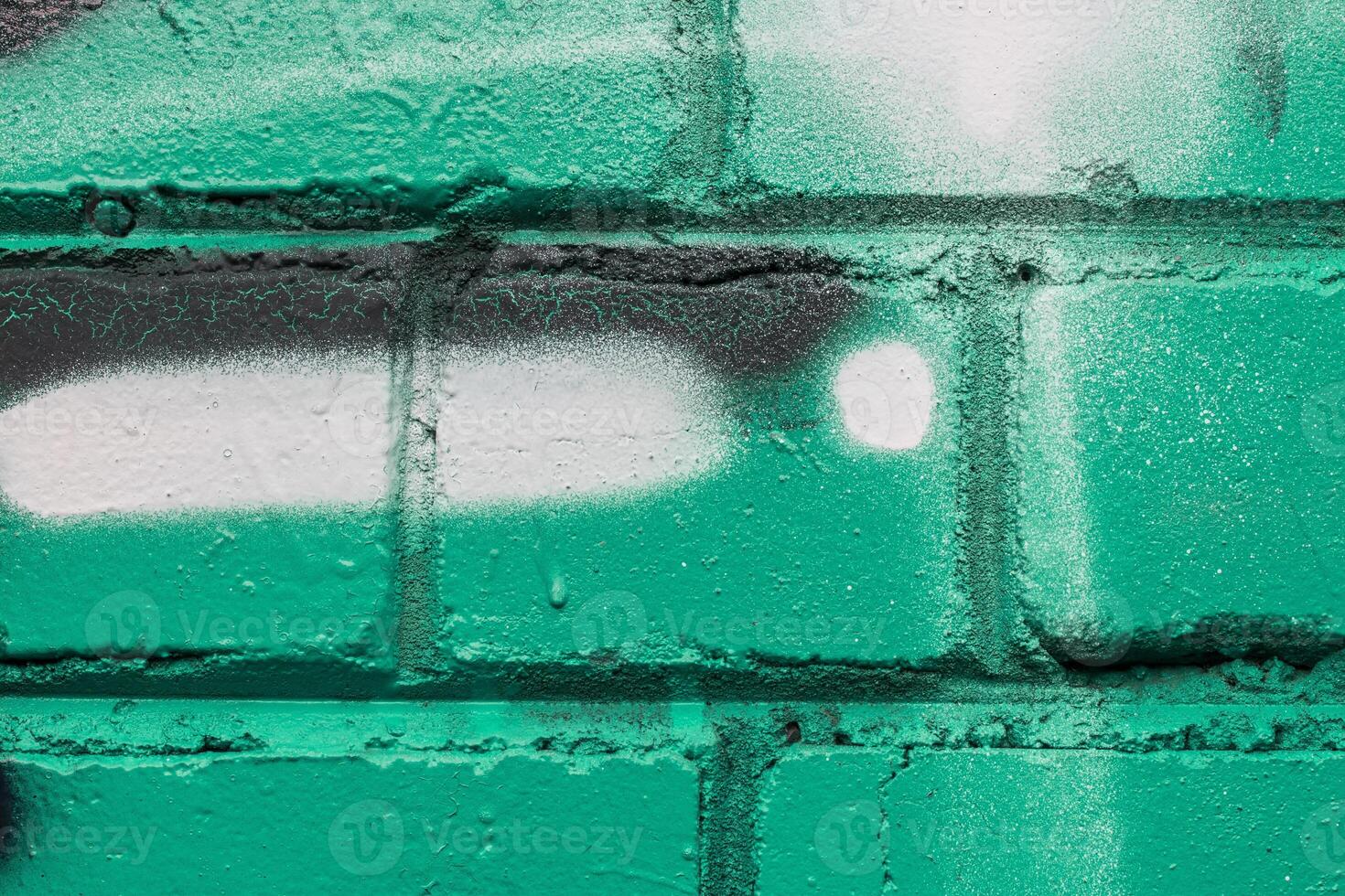 Graffiti painted on a brick wall texture. photo