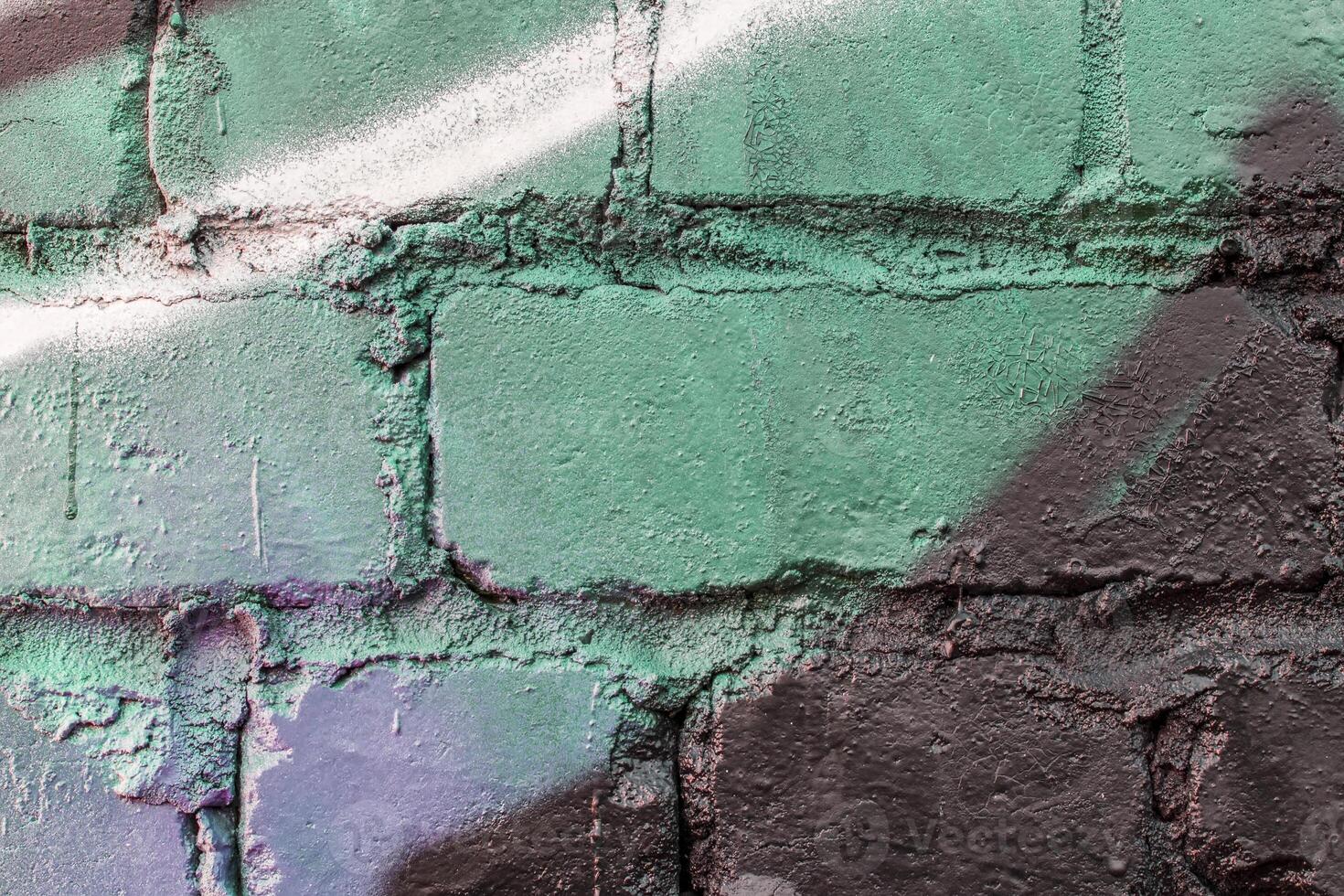 Graffiti painted on a brick wall texture. photo