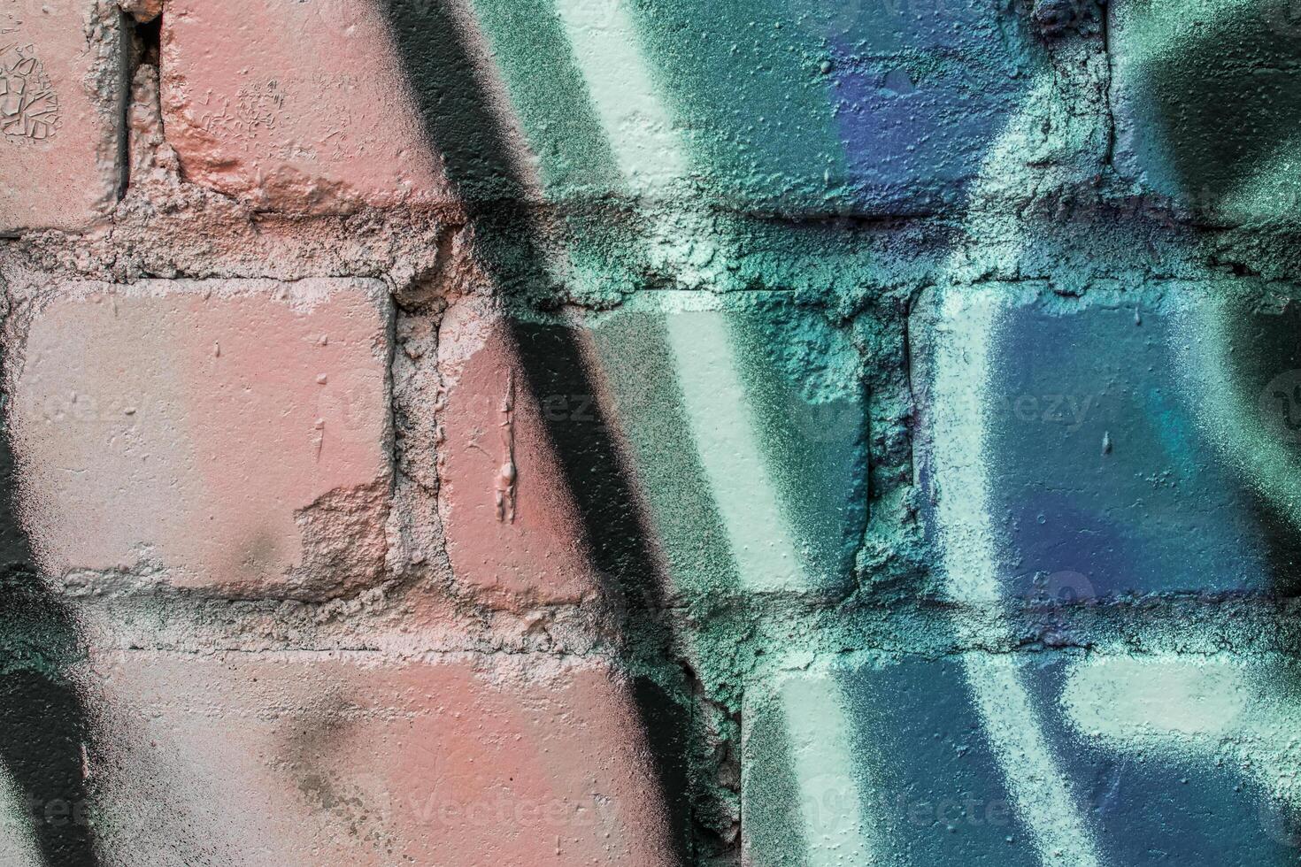 Graffiti painted on a brick wall texture. photo
