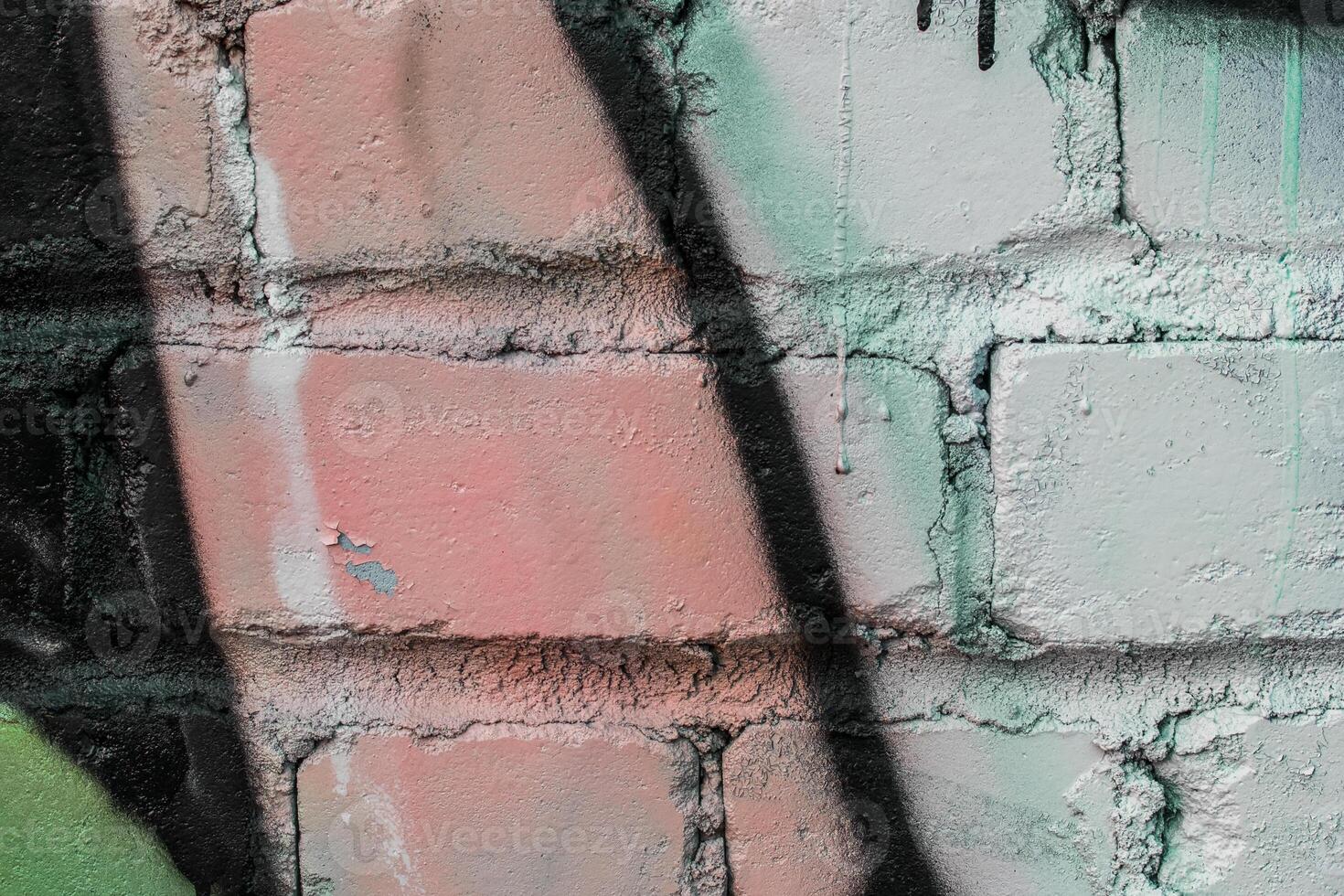 Graffiti painted on a brick wall texture. photo