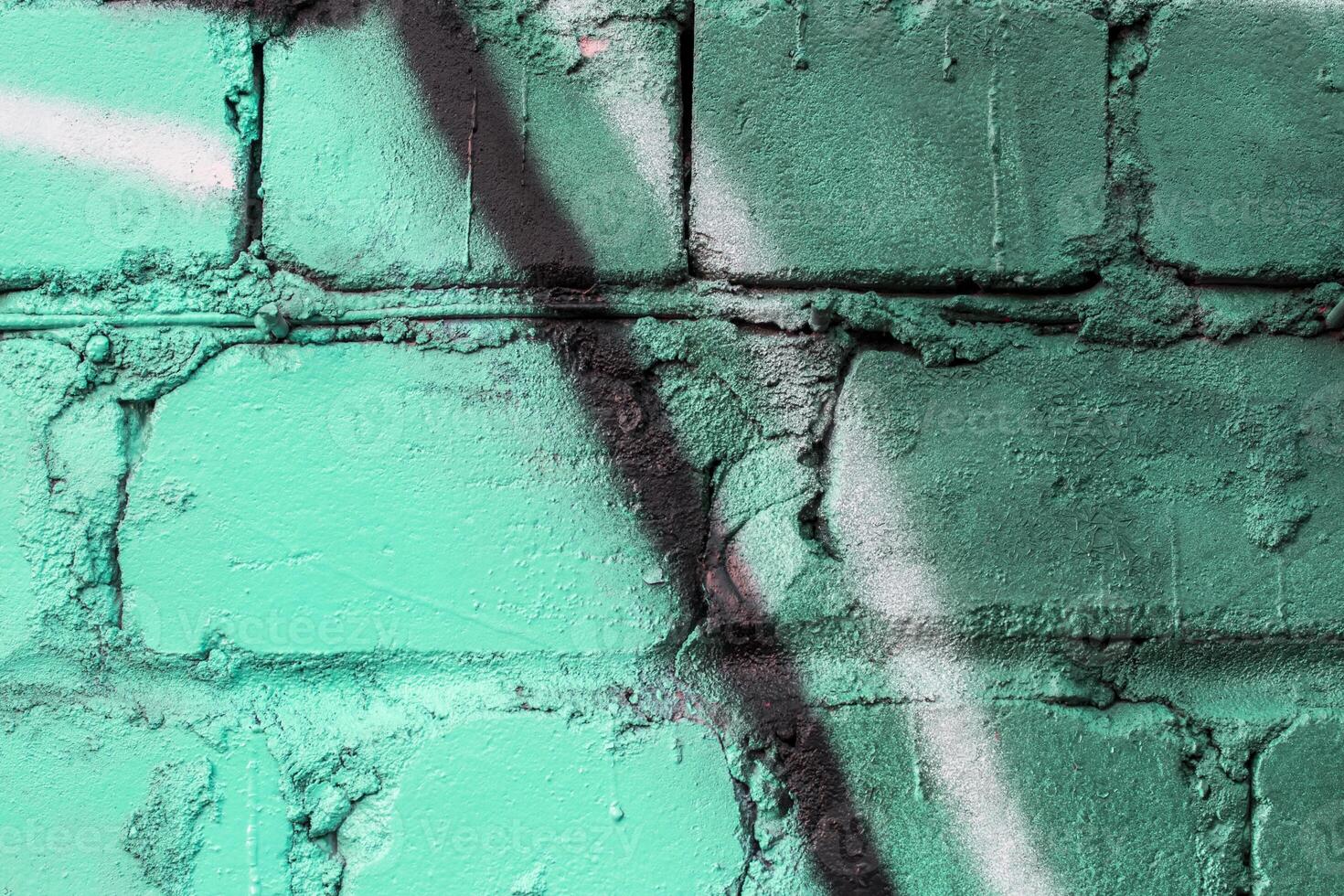 Graffiti painted on a brick wall texture. photo