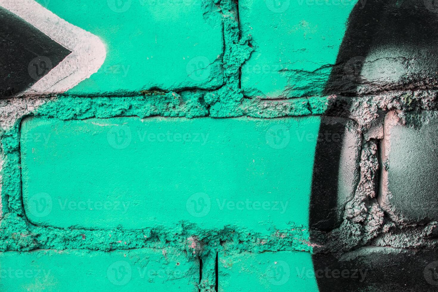 Graffiti painted on a brick wall texture. photo