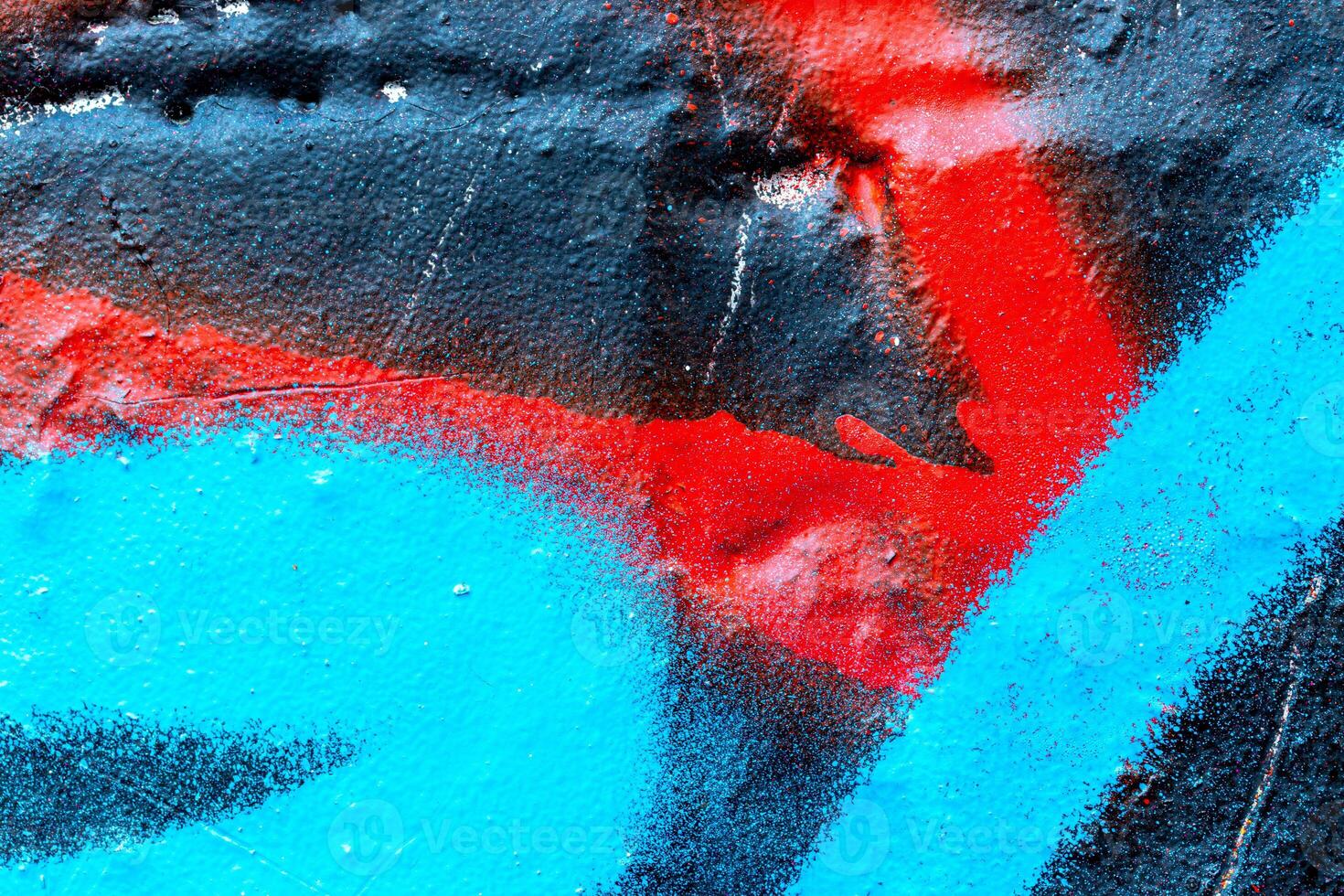 Fragment of colored graffiti painted on a wall. Bright abstract background. photo
