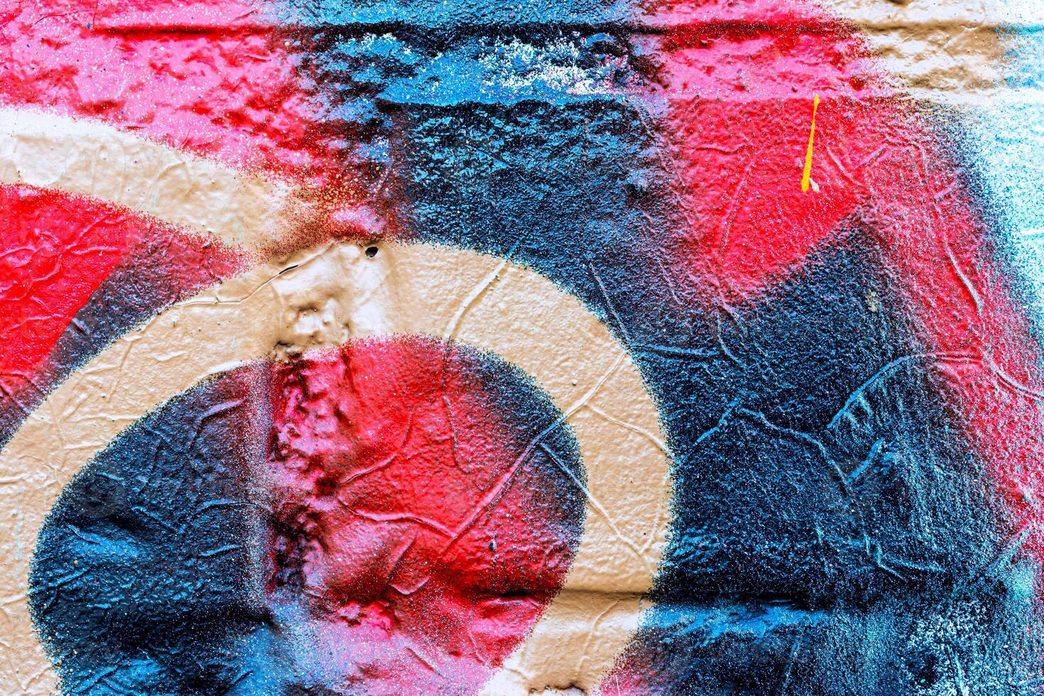 Fragment of colored graffiti painted on a wall. Bright abstract background. photo