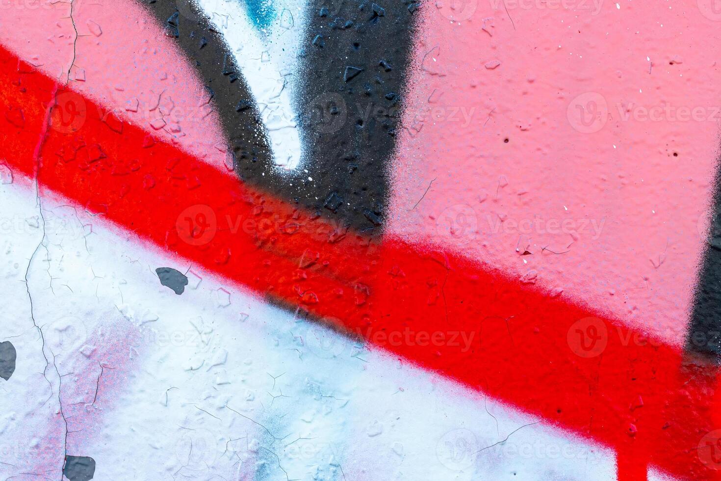 Fragment of colored graffiti painted on a wall. Bright abstract background. photo