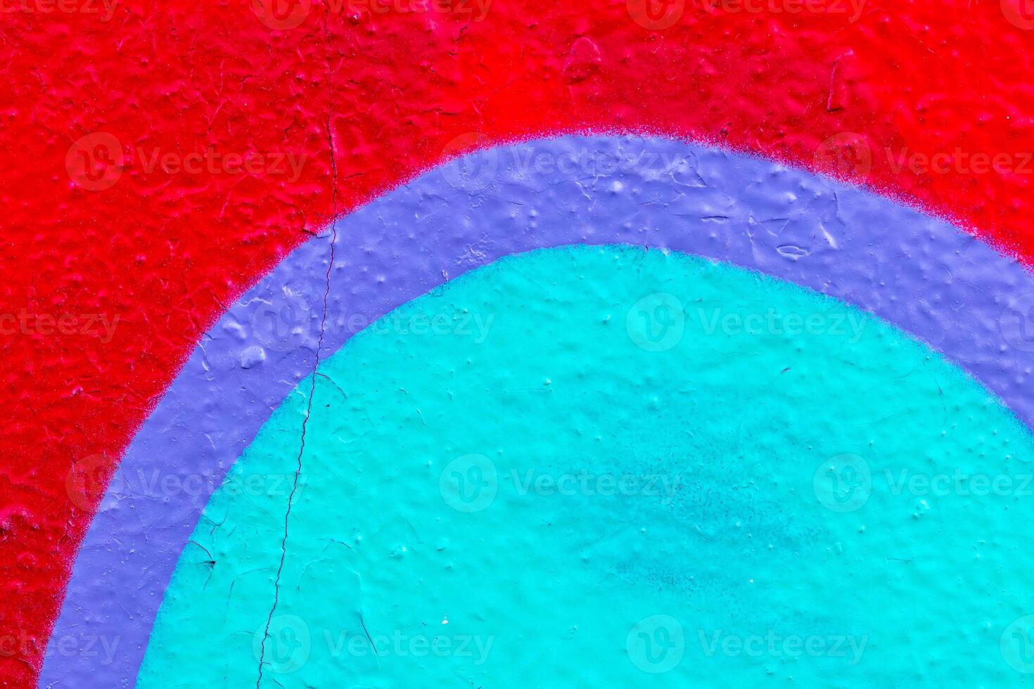 Fragment of colored graffiti painted on a wall. Bright abstract background. photo