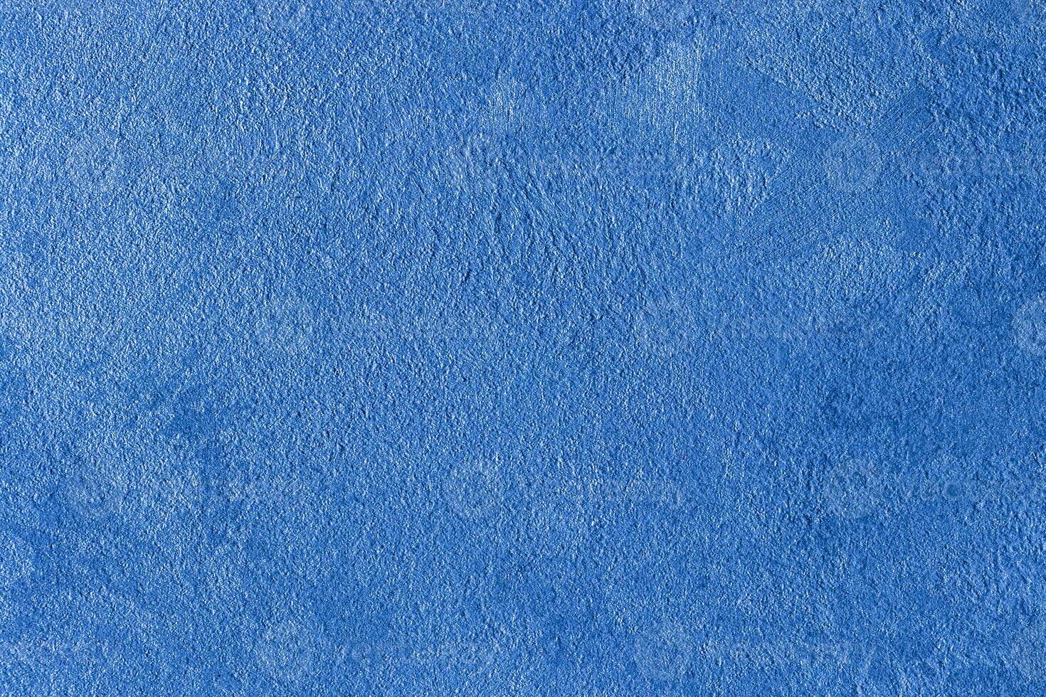 Texture of blue decorative plaster or stucco or concrete. Abstract background for design. photo