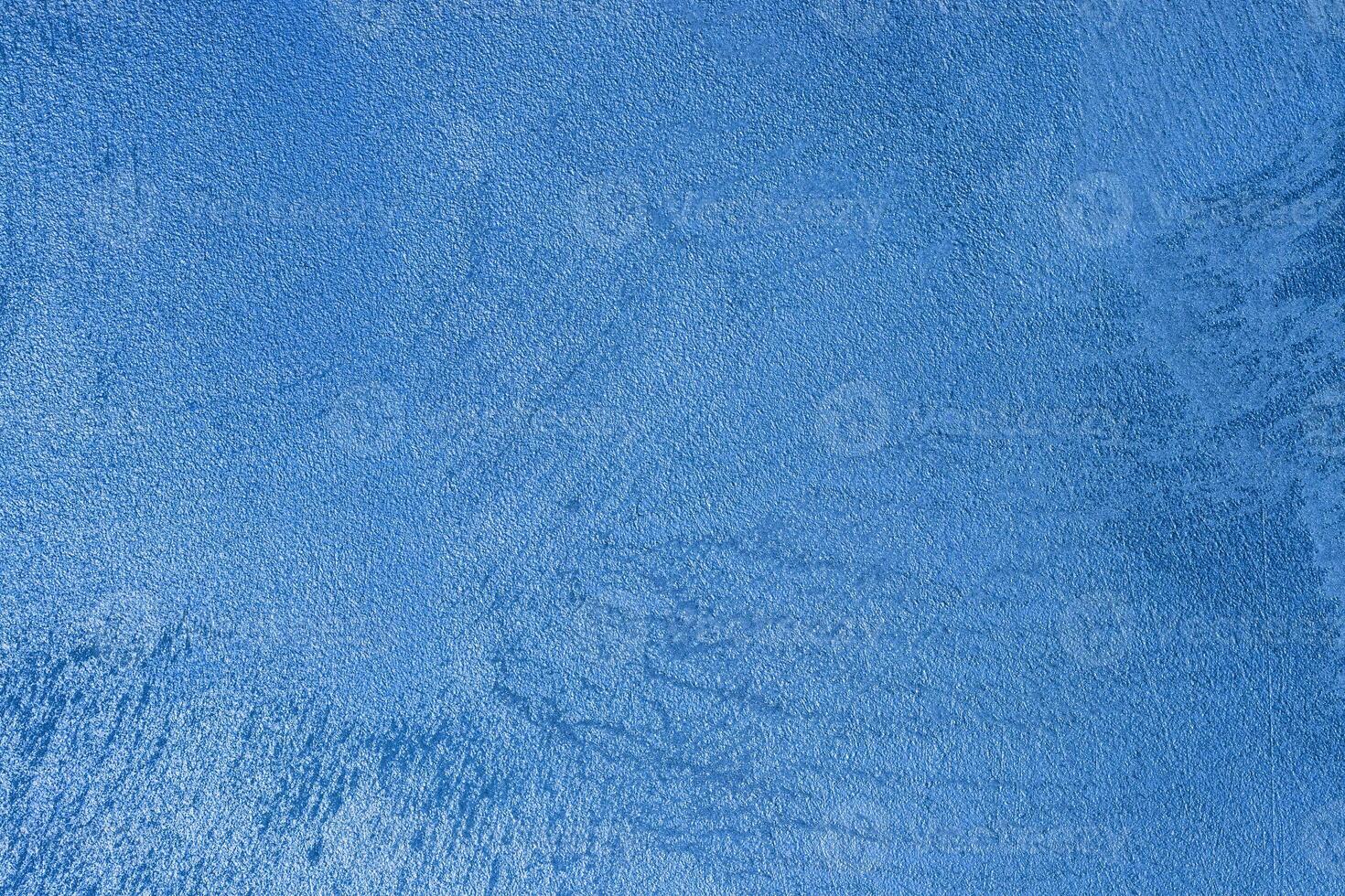Texture of blue decorative plaster or stucco or concrete. Abstract background for design. photo