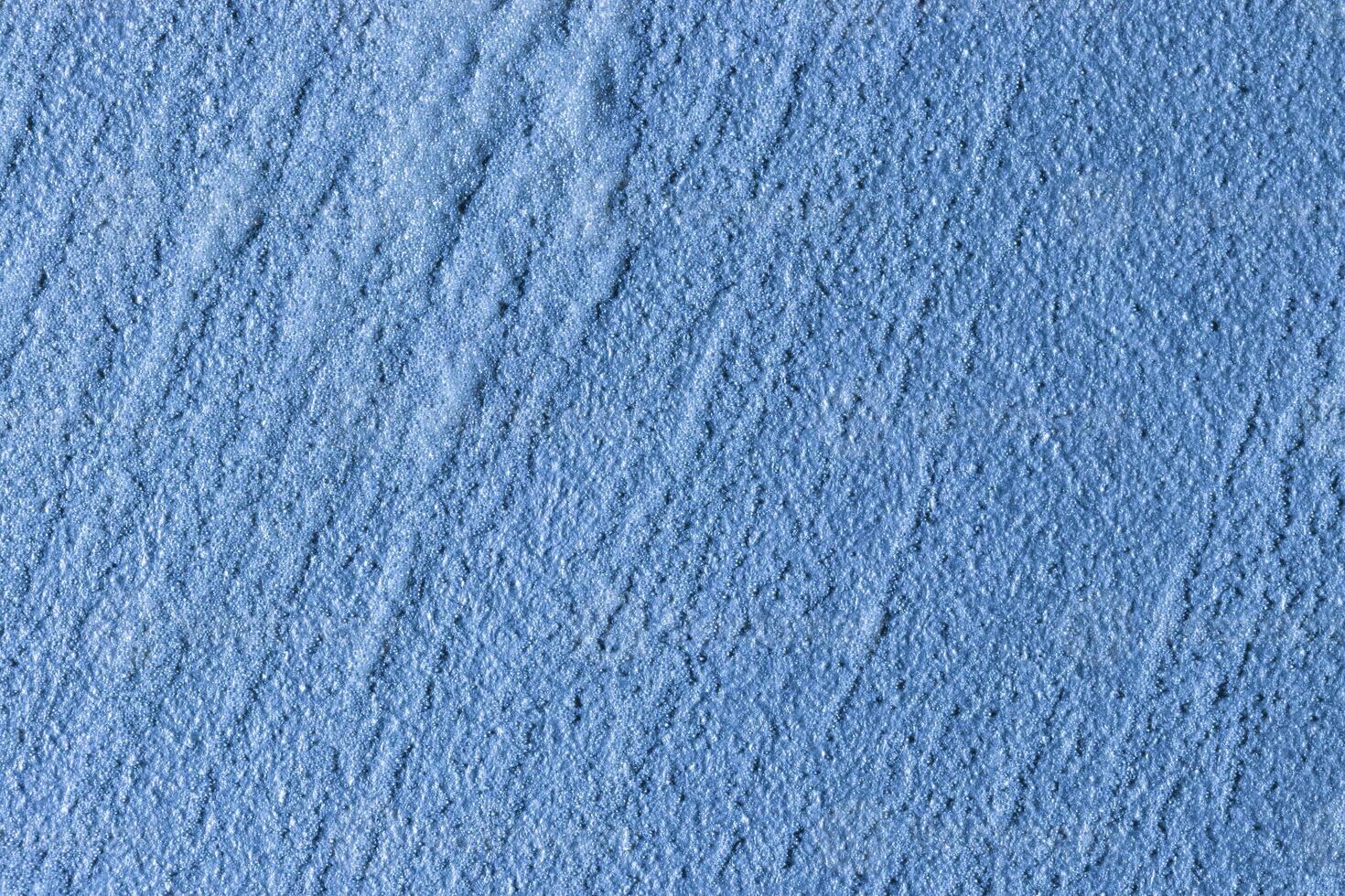 Texture of blue decorative plaster or stucco or concrete. Abstract background for design. photo