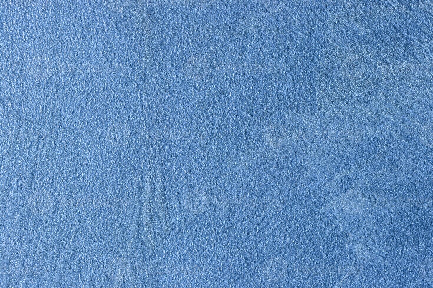 Texture of blue decorative plaster or stucco or concrete. Abstract background for design. photo
