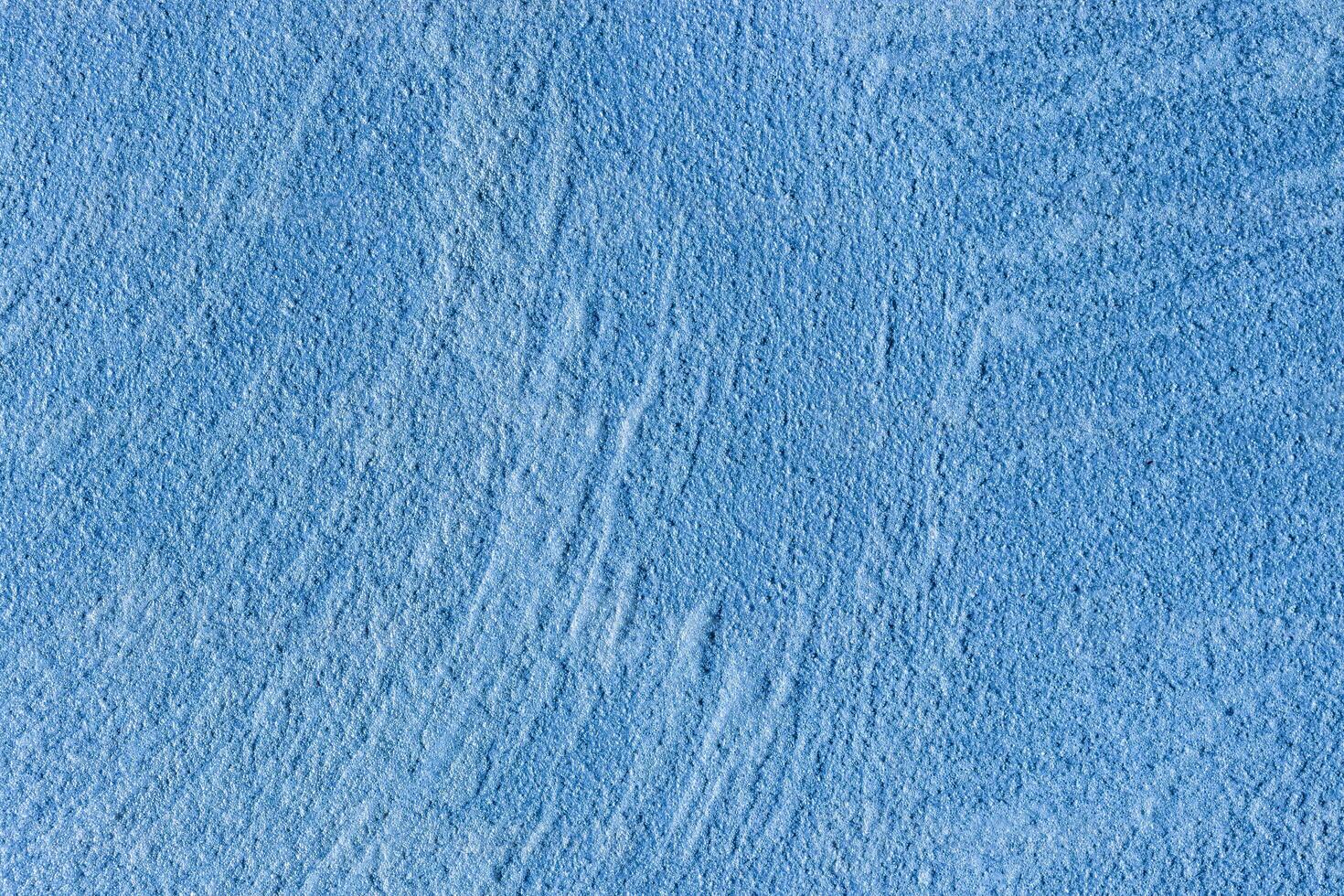 Texture of blue decorative plaster or stucco or concrete. Abstract background for design. photo
