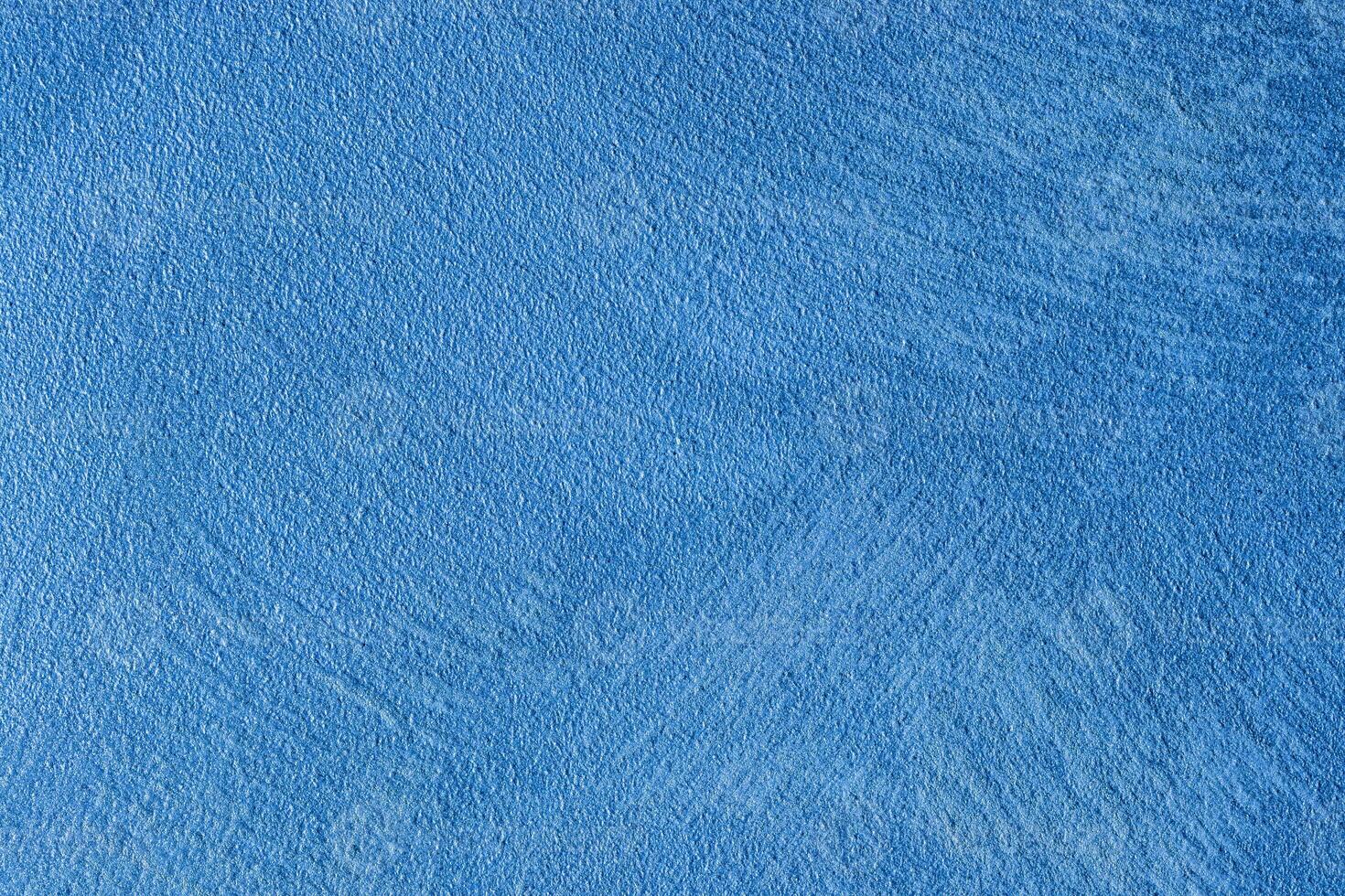 Texture of blue decorative plaster or stucco or concrete. Abstract background for design. photo