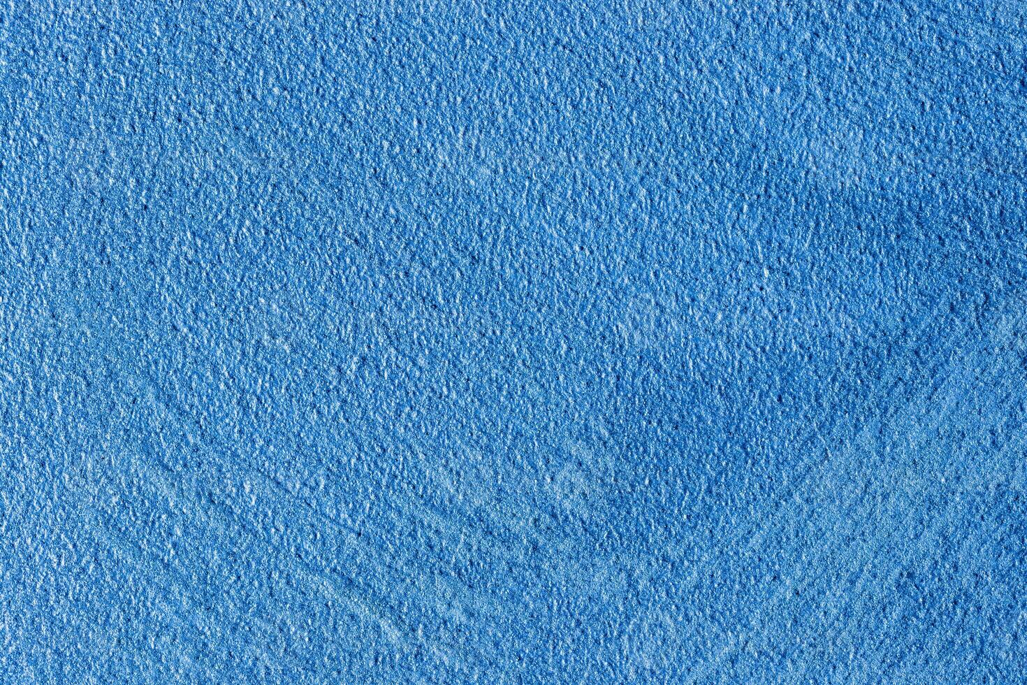 Texture of blue decorative plaster or stucco or concrete. Abstract background for design. photo