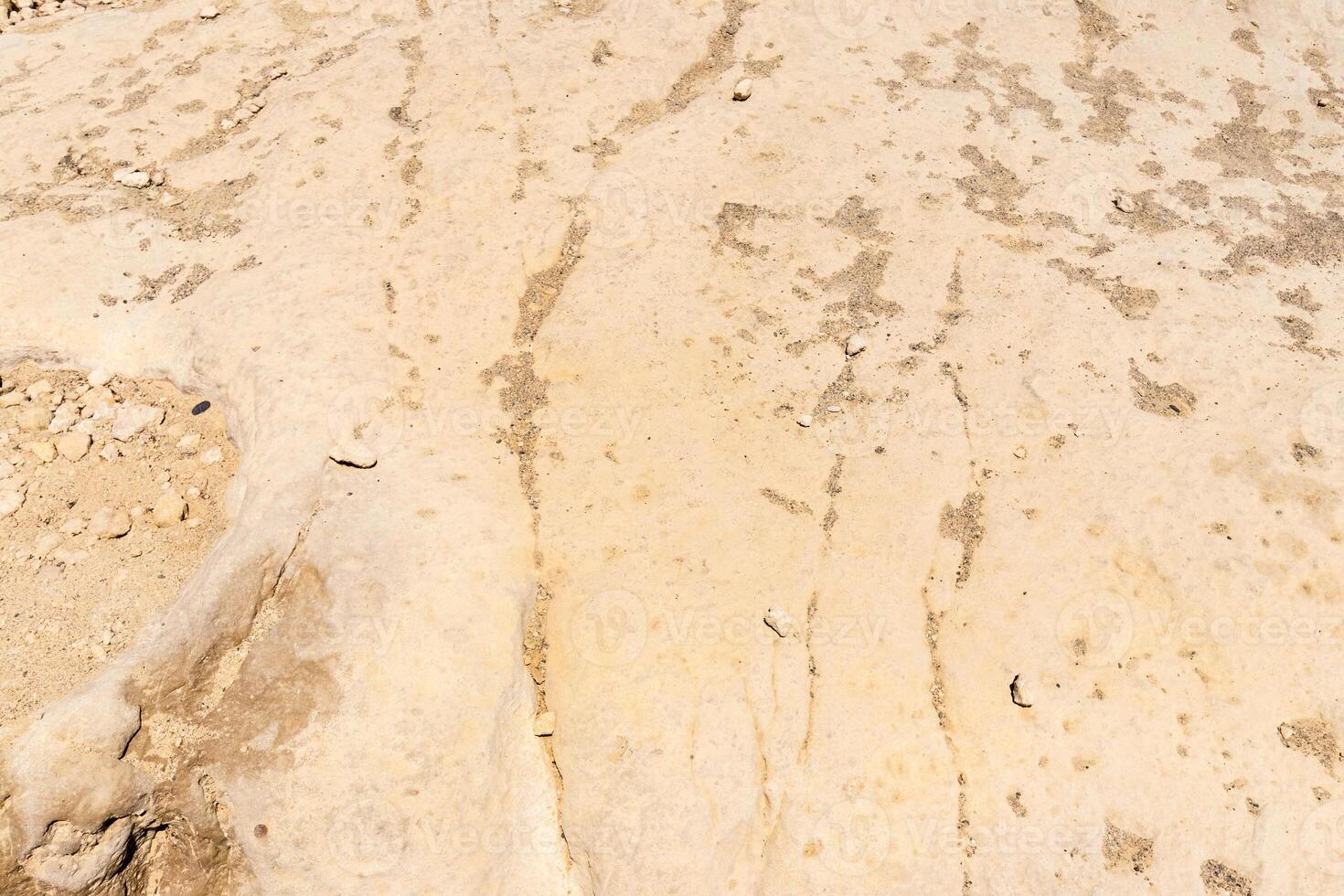 Texture of a yellow stone rock. photo