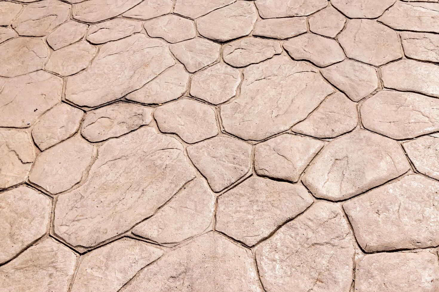 Yellow stone pavement abstract background. photo