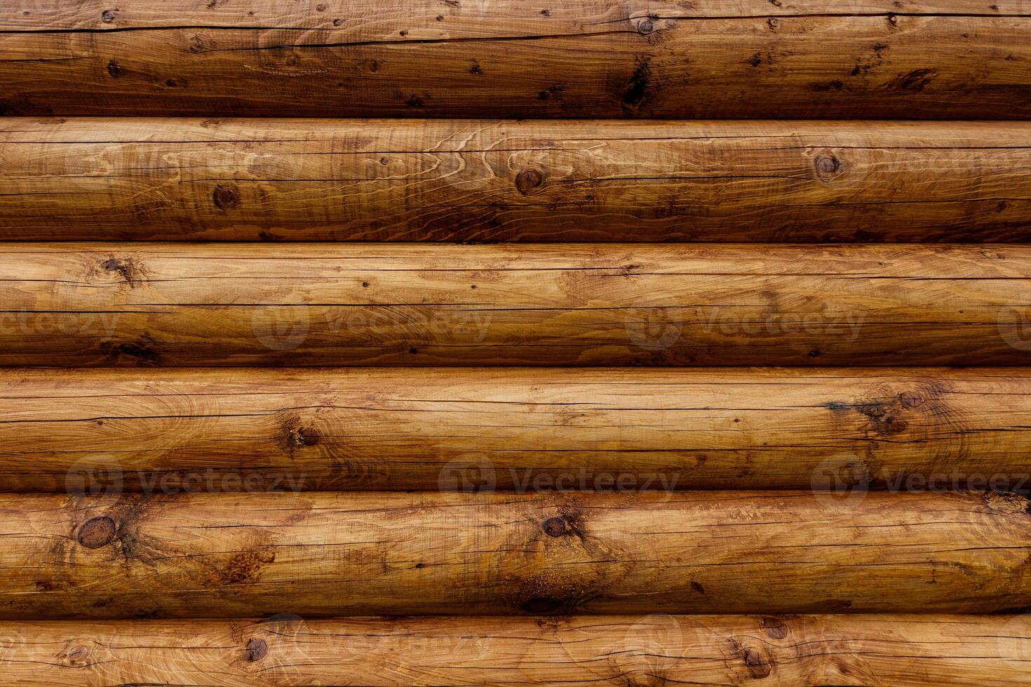 Wooden wall from logs as a background. photo