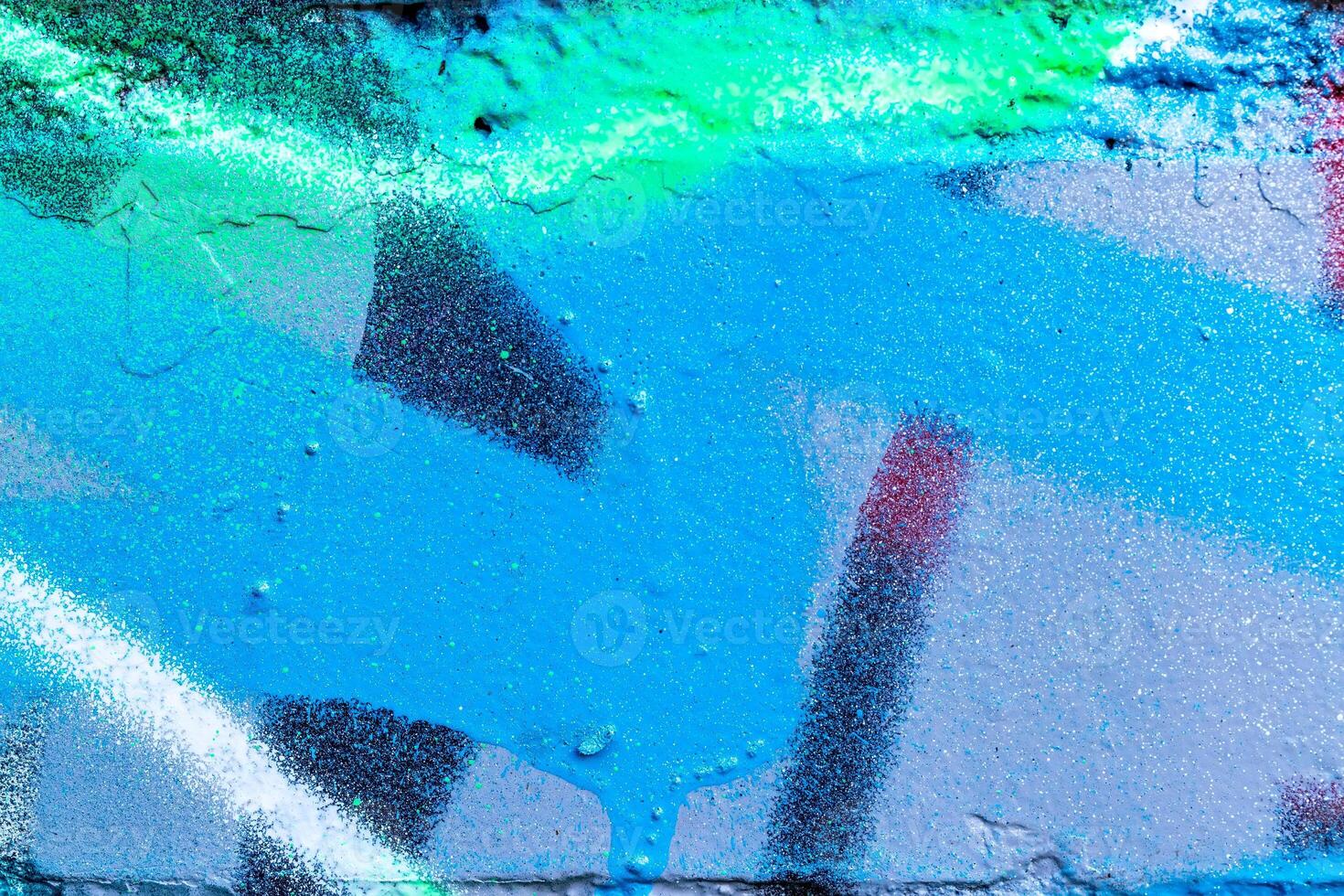 Fragment of colored graffiti painted on a brick wall. photo