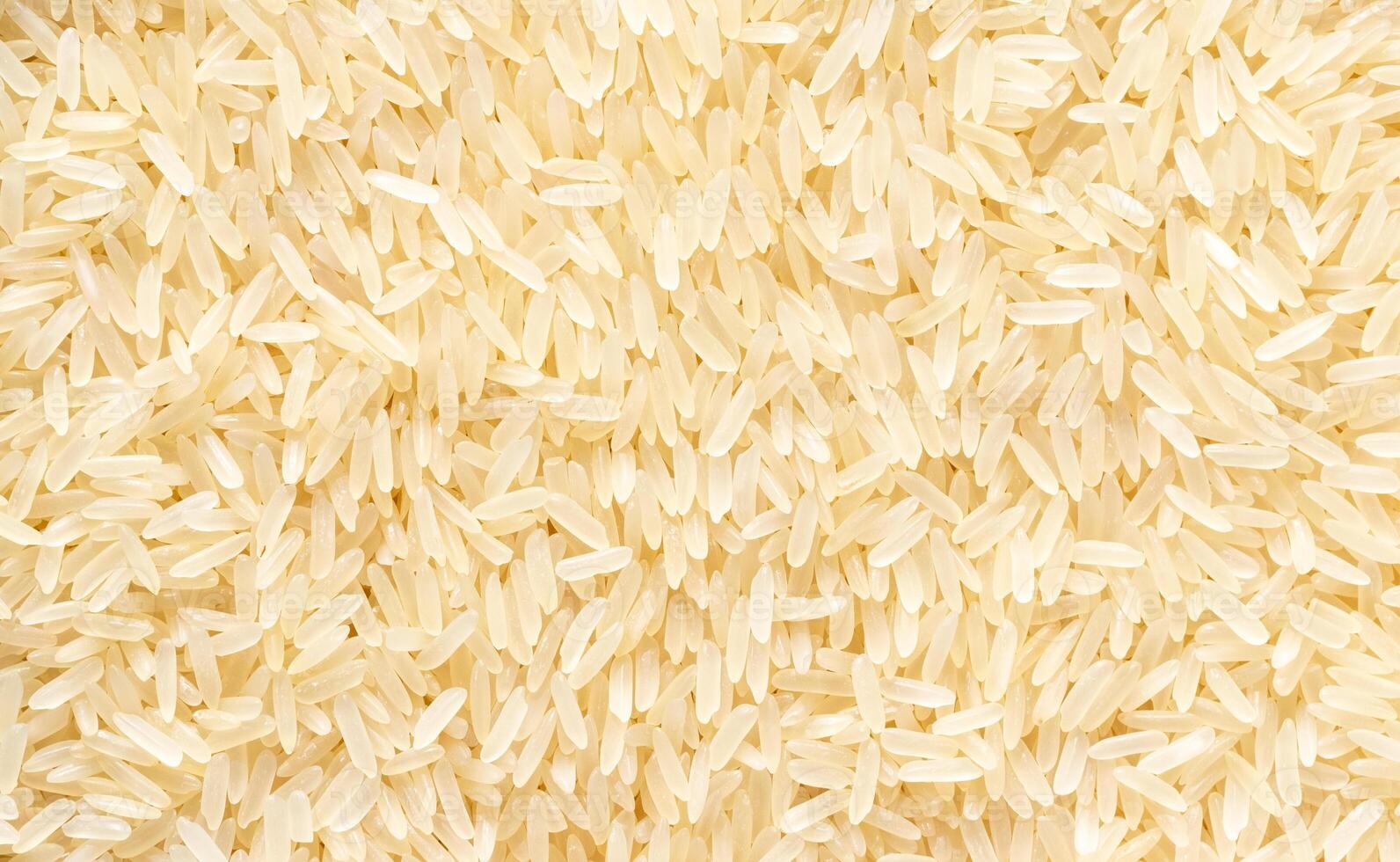 Rice grains background or texture. Healthy vegeterian food. photo