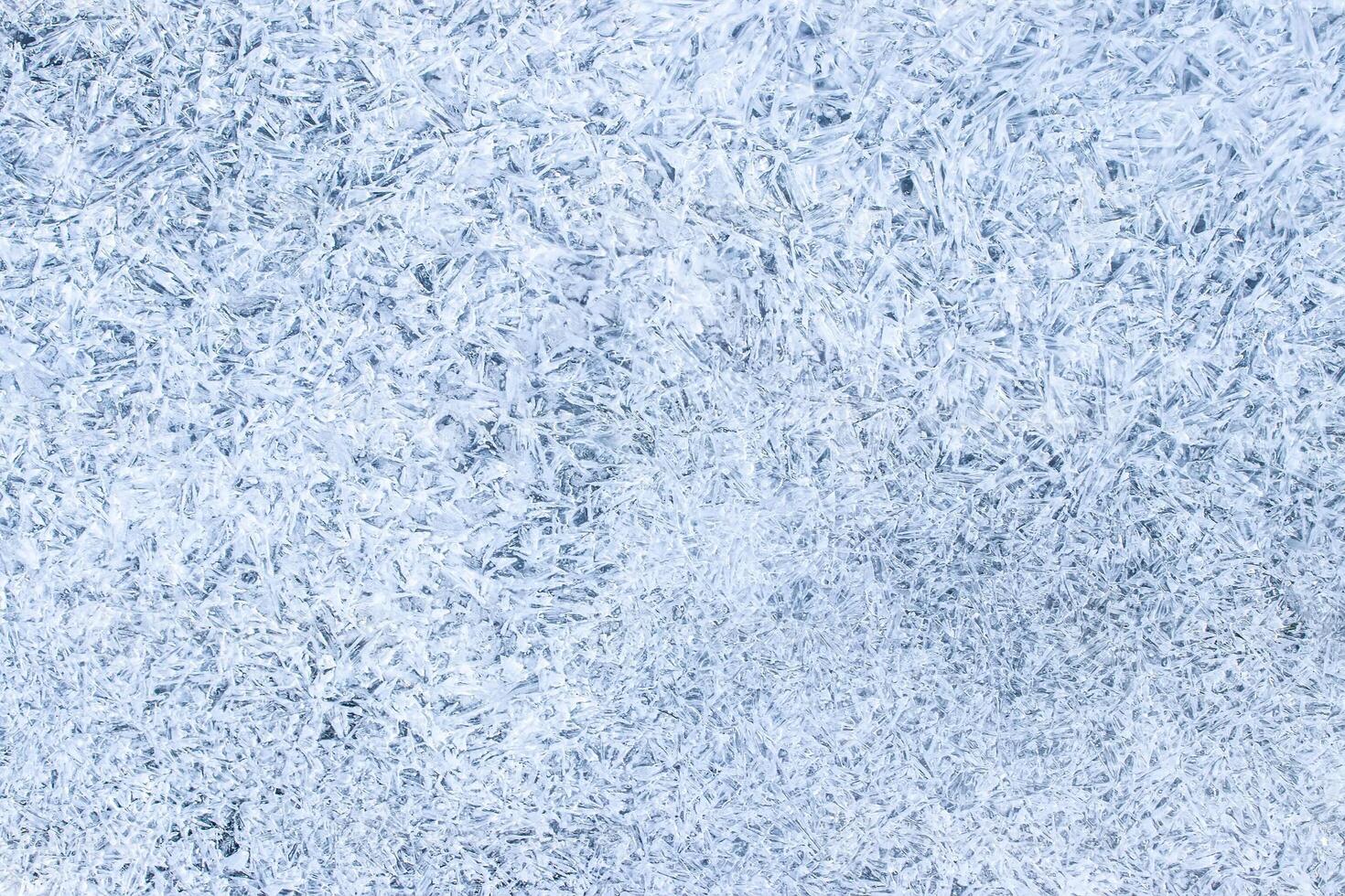 Texture of ice in the winter. Abstract background for design, photographed closeup. photo