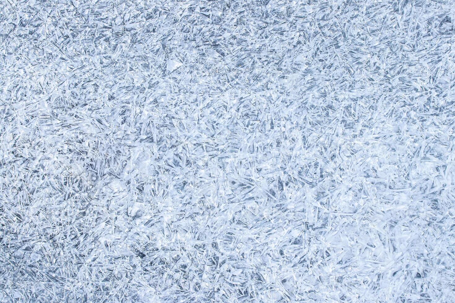 Texture of ice in the winter. Abstract background for design, photographed closeup. photo