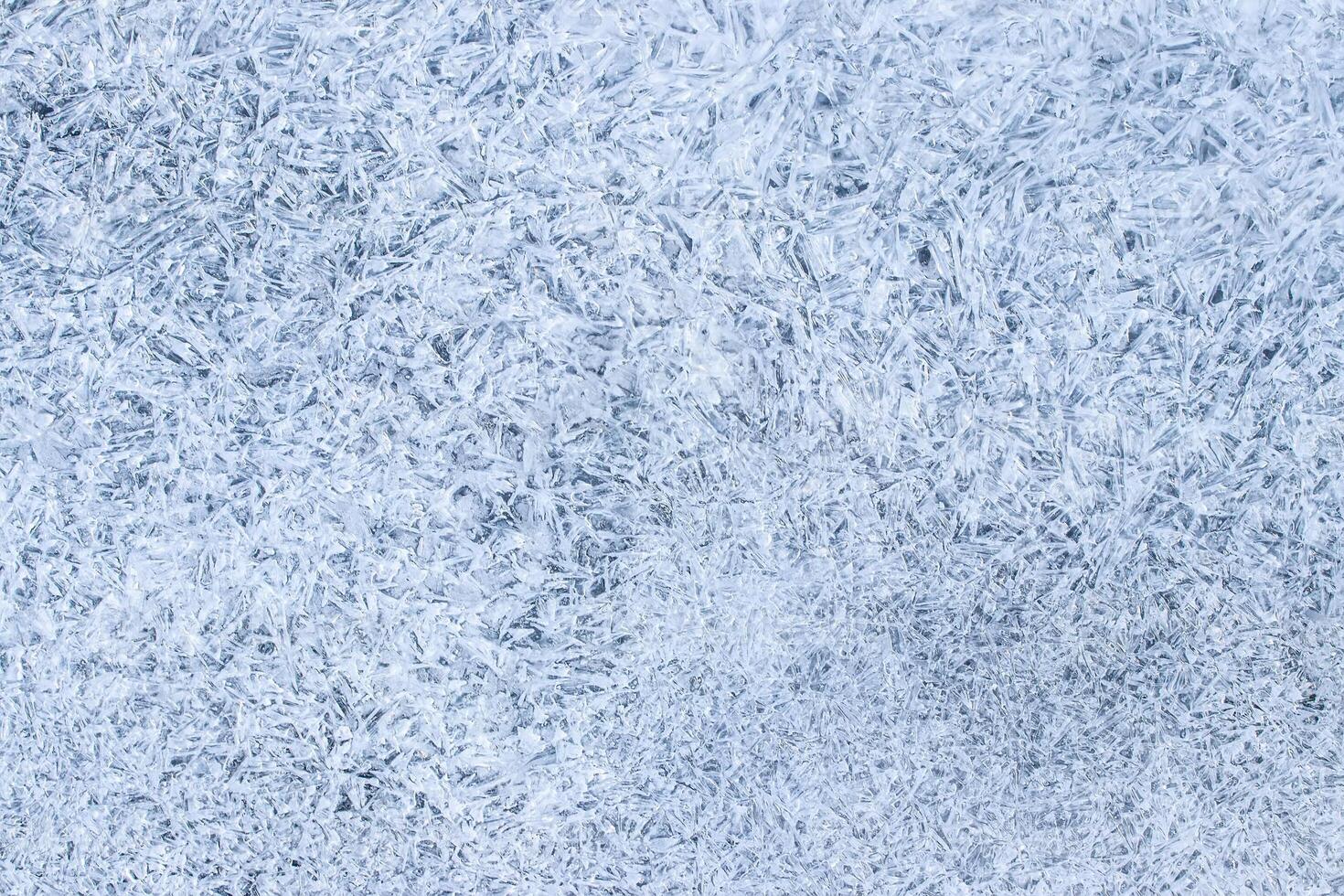 Texture of ice in the winter. Abstract background for design, photographed closeup. photo