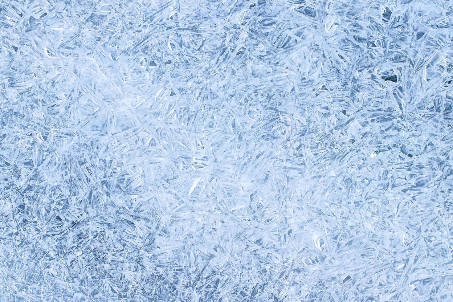 Texture of ice in the winter. Abstract background for design, photographed closeup. photo