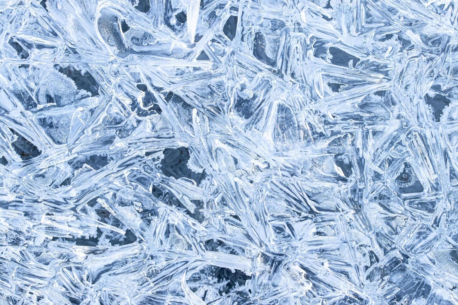 Texture of ice in the winter. Abstract background for design, photographed closeup. photo