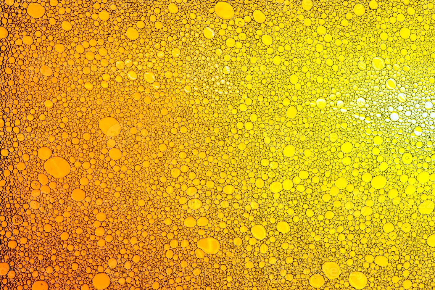Colorful drops of oil on the water. photo