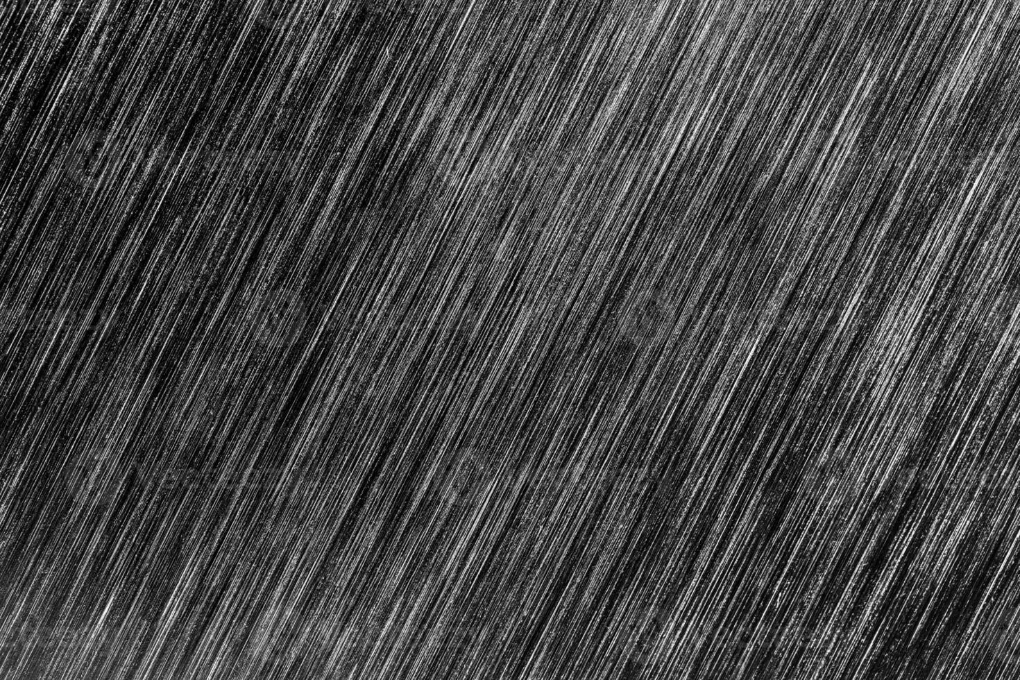 Black metal texture with white scratches. Abstract noise black background overlay. photo