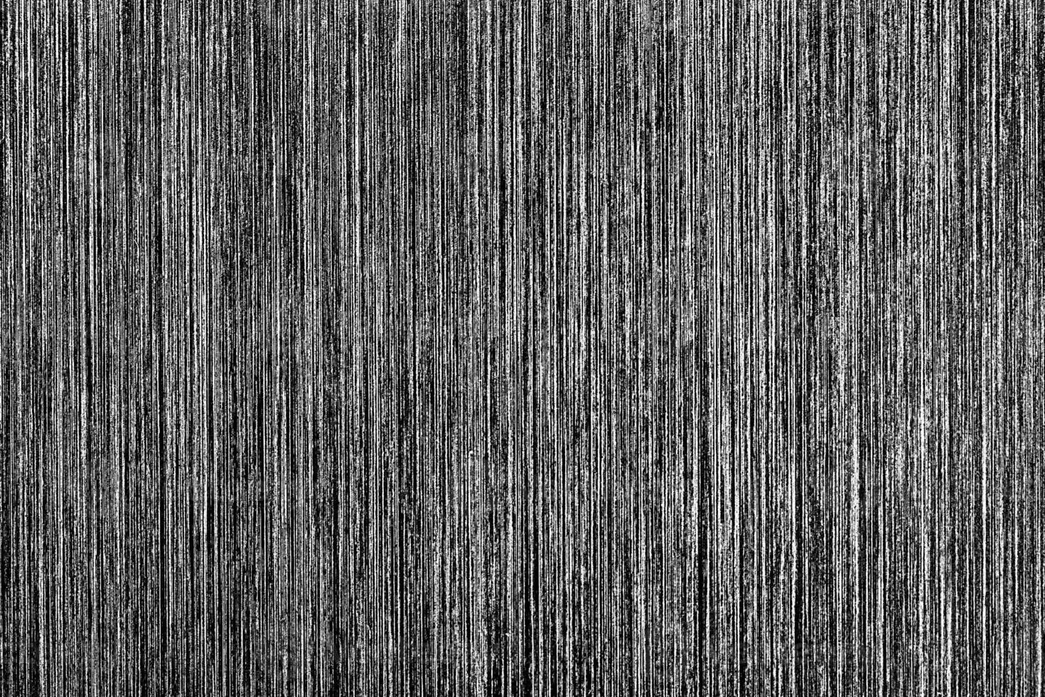 Metal texture with white scratches. Abstract noise black background overlay for design. photo
