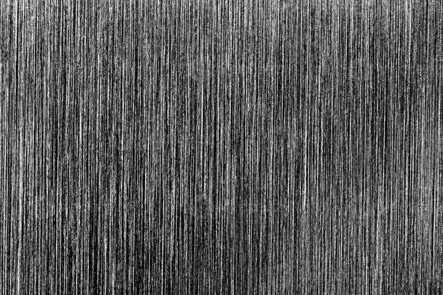 Metal texture with white scratches. Abstract noise black background overlay for design. photo