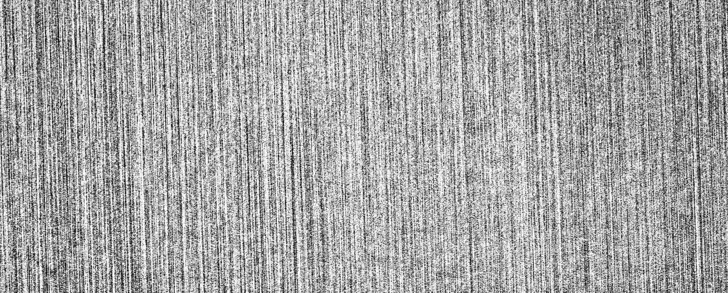 Metal texture with white scratches. Abstract noise black background overlay for design. photo
