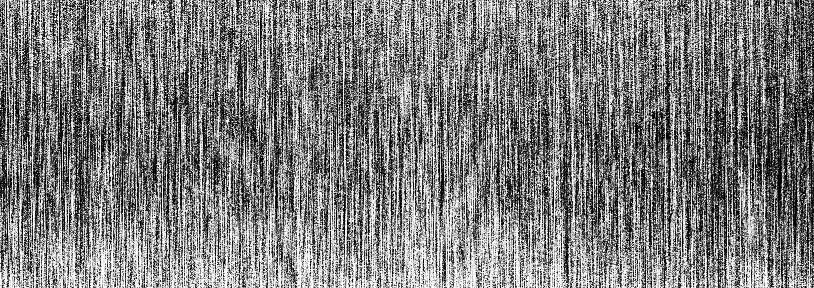 Metal texture with white scratches. Abstract noise black background overlay for design. photo