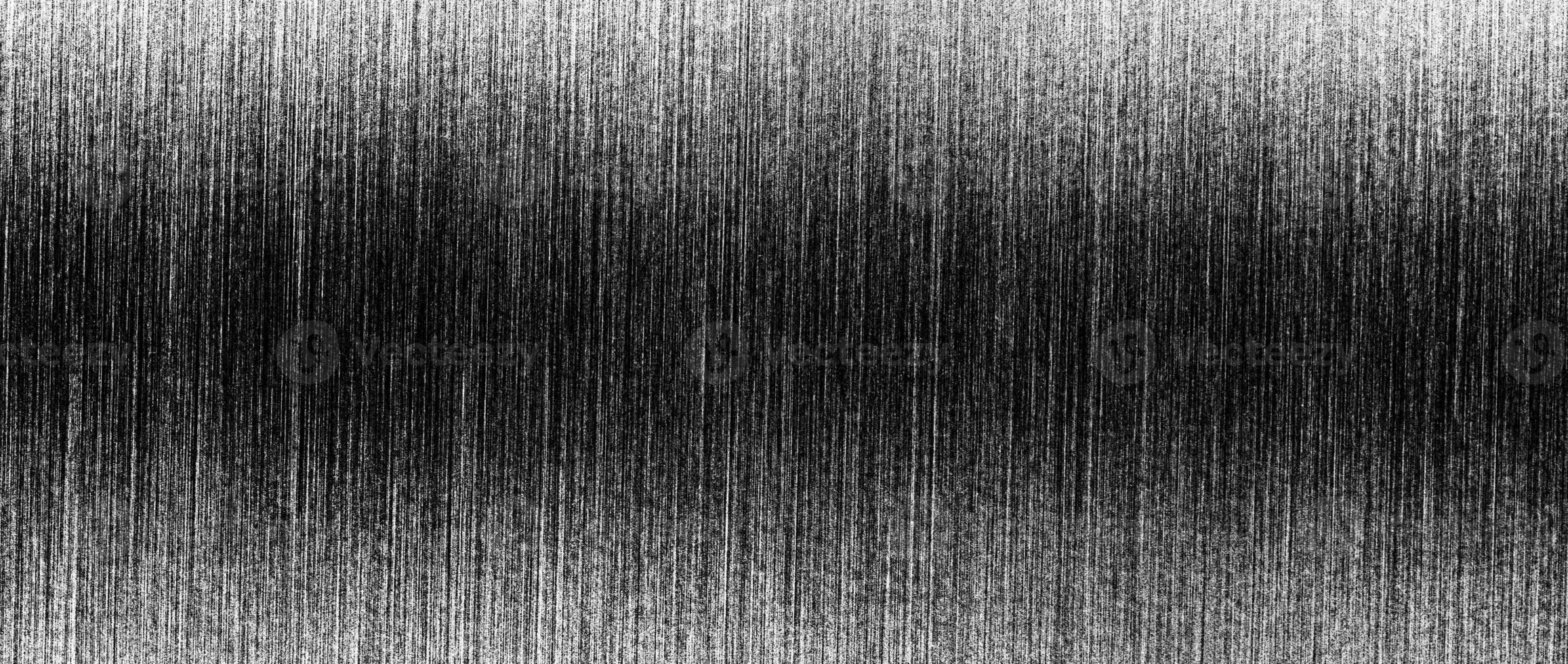 Metal texture with white scratches. Abstract noise black background overlay for design. photo