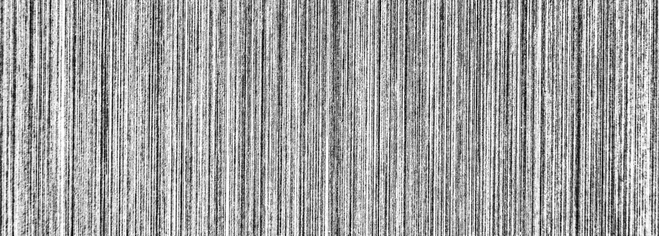 Metal texture with white scratches. Abstract noise black background overlay for design. photo