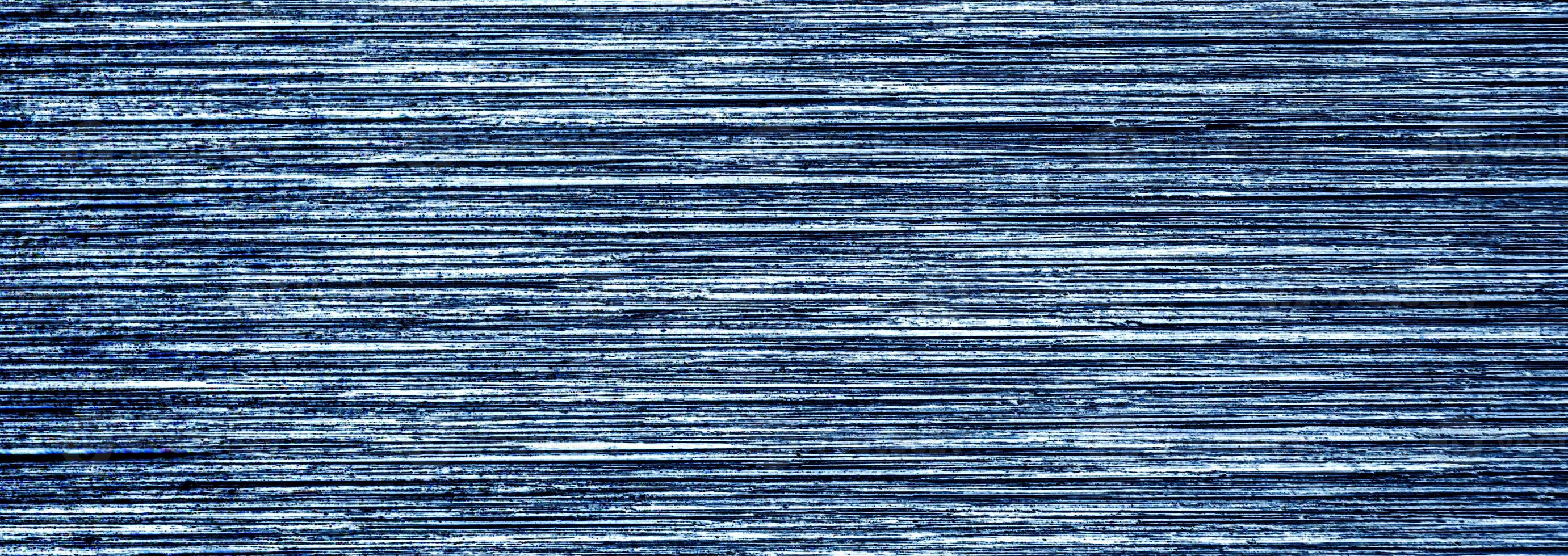 Metal texture with white scratches. Abstract noise black background overlay for design. photo