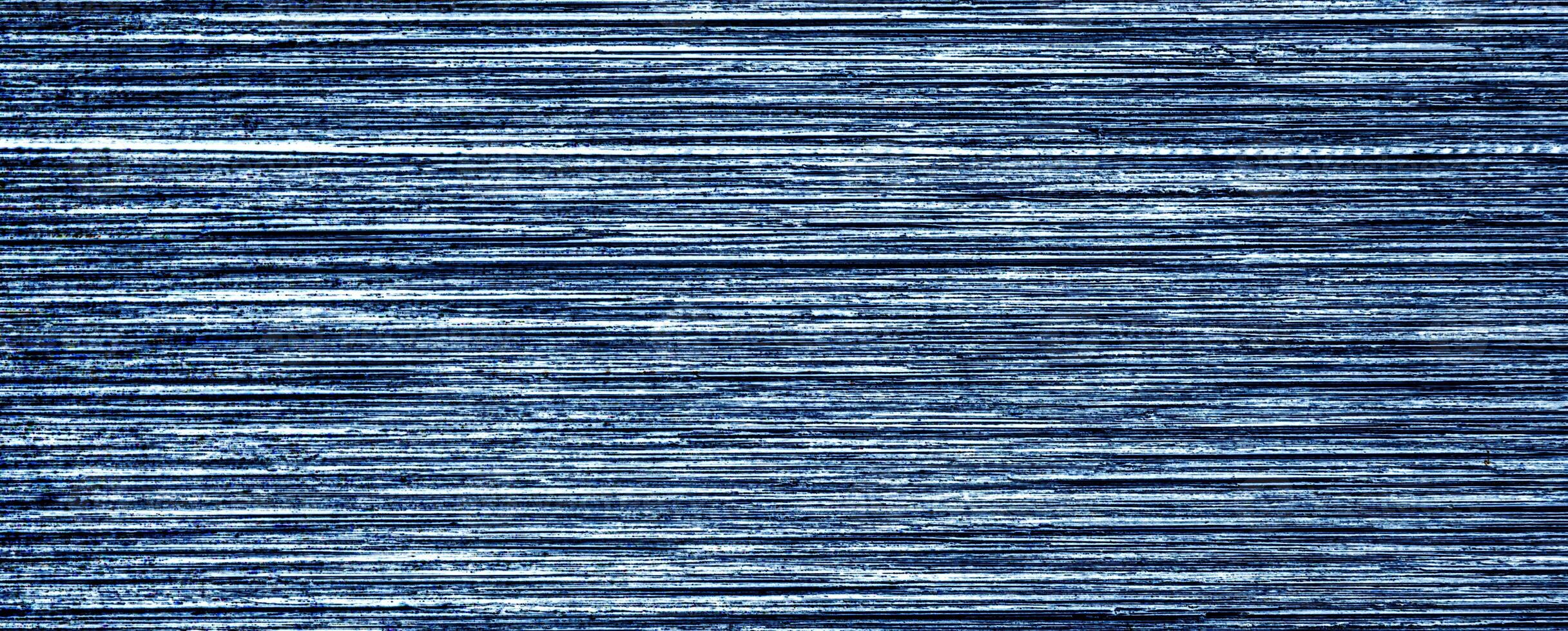 Metal texture with white scratches. Abstract noise black background overlay for design. photo